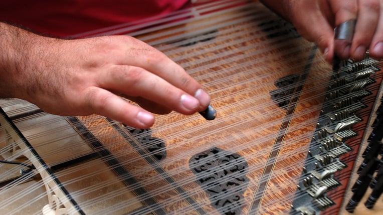 Playing turkish zither, kanun