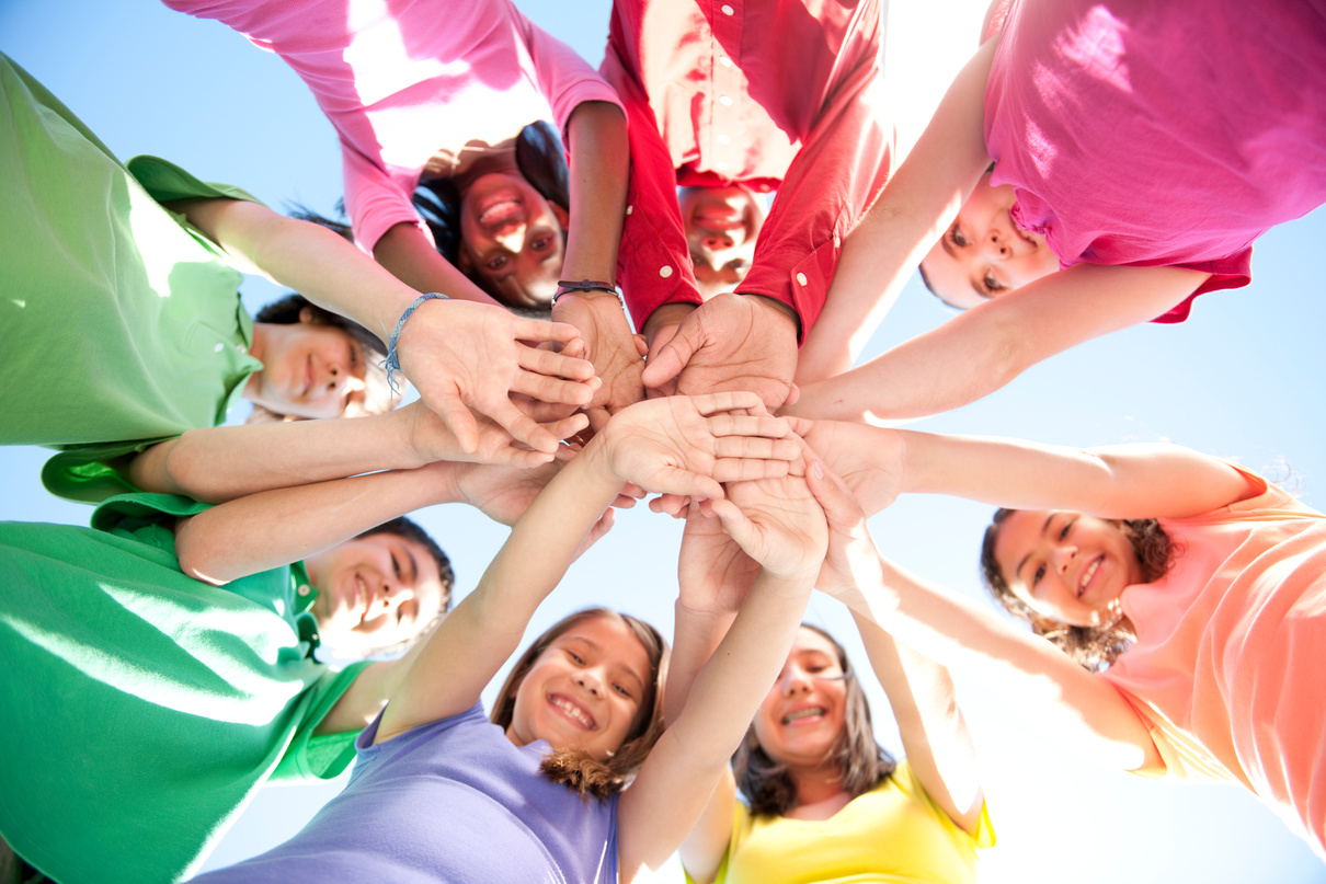 Children's Hands in a Huddle